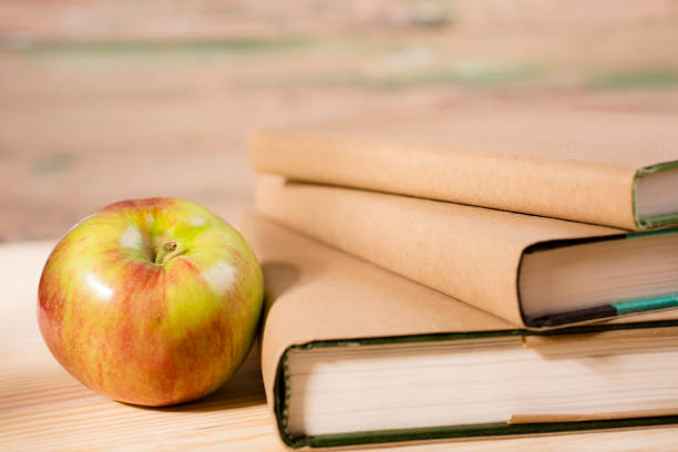 istock Back to school. Education. Books on desk. Apple. 543664782