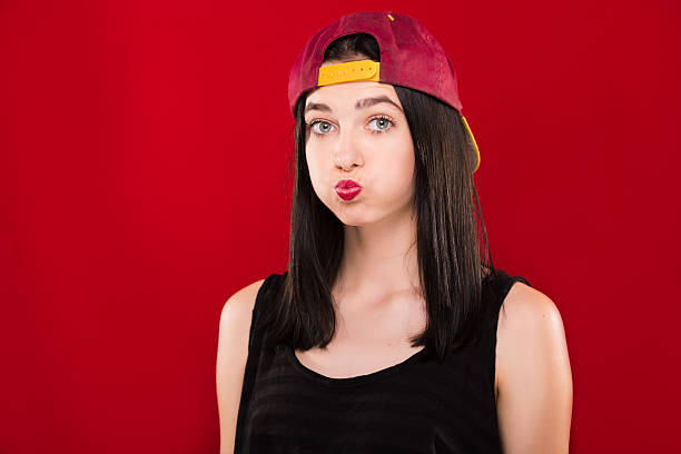 istock Cute brunette girl standing with blown cheeks in studio 543665206