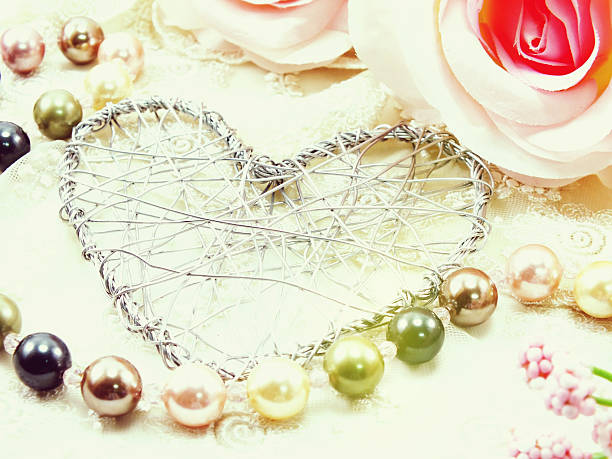 istock heart symbol decoration with artificial roses flower 543666914
