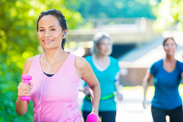 istock Senior woman power walks in park 543667448