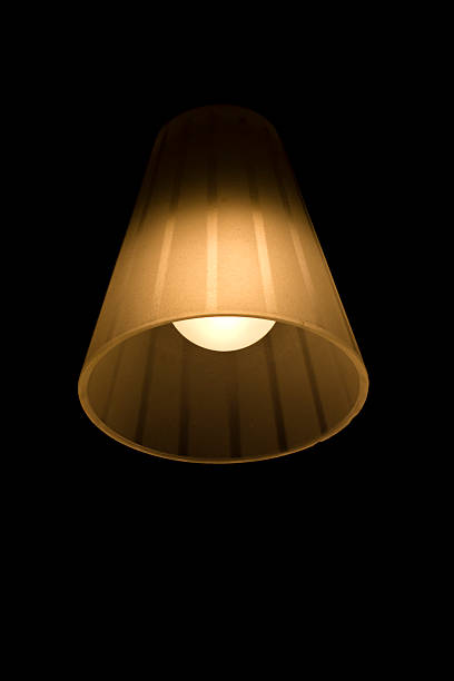 istock Lamp with bulb shining in the darkness 543668440