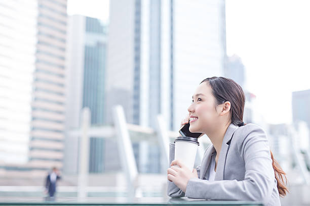 istock business woman speak smart phone 543672436