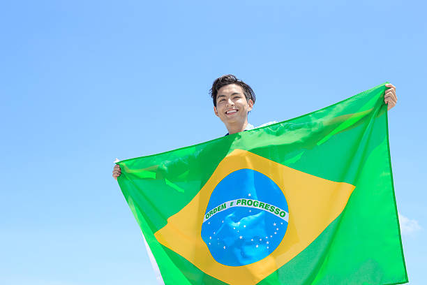 istock Excited man holding brazil flag 543672814