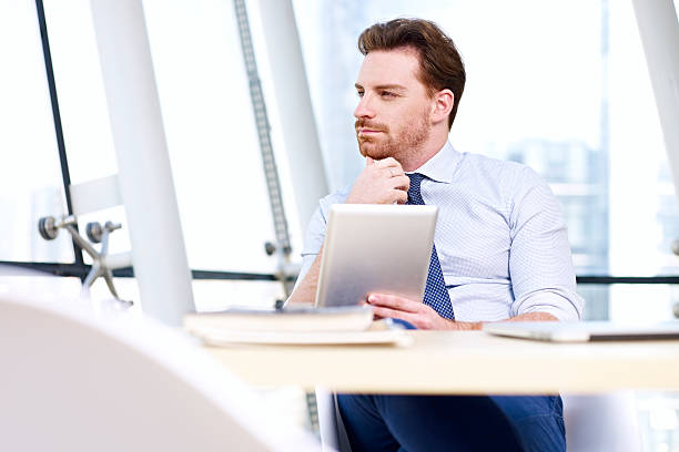 istock business person thinking in office 543673144
