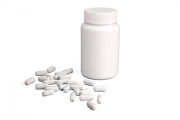 istock White medicine bottle and pills 543673652
