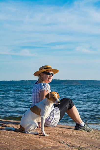 istock Woman and dog on beach 543674126