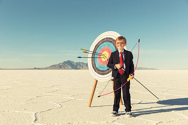 Young Boy and Business Archer With Target
