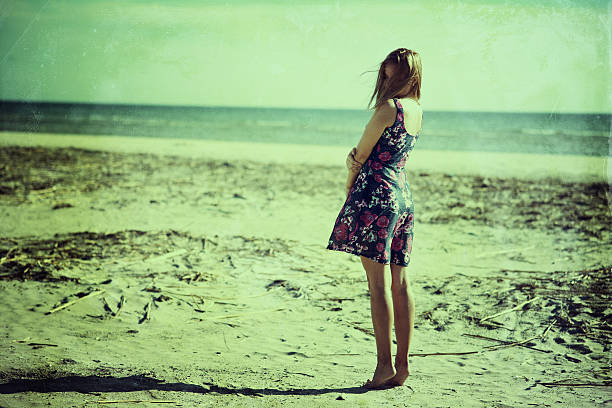 istock Young woman on the sea beach 543674304
