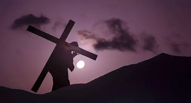 Christ carrying cross up Calvary on Good Friday over bright sky
