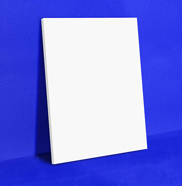 istock Blank poster canvas frame leaning at vivid blue concrete 543675684