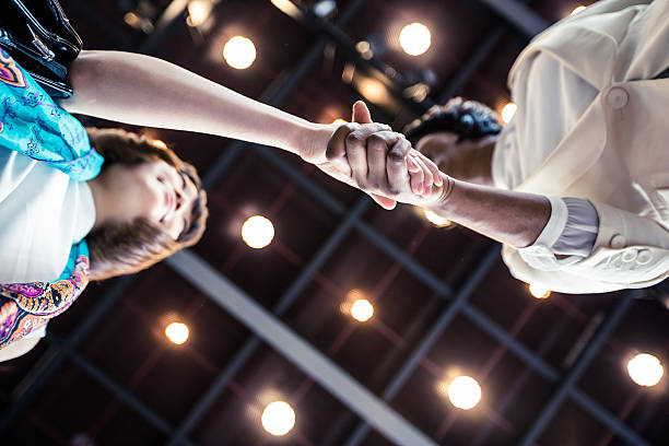 Business Executives shaking hands over an agreement.