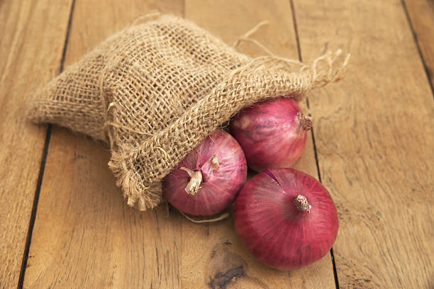 istock Shallot pouring out of burlap sack 543678034