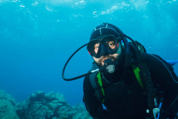 istock Scuba diving     Underwater scene with man scuba diver in blue 543679336