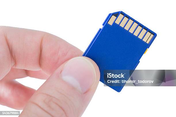 Holding A Blue Memory Card Stock Photo - Download Image Now - Blue, Business Finance and Industry, Close-up