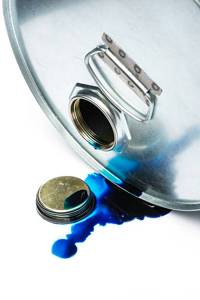 istock Steel chemicals drum with pollution liquid over the white background 543680816