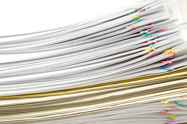 istock White document and paperclip place switching with brown envelope 543682664