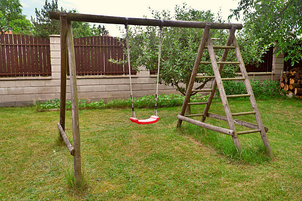 istock Garden red plastic children's swing 543682812