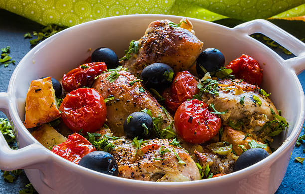 istock Chicken legs with potatoes, cherry tomatoes and black olives 543686762