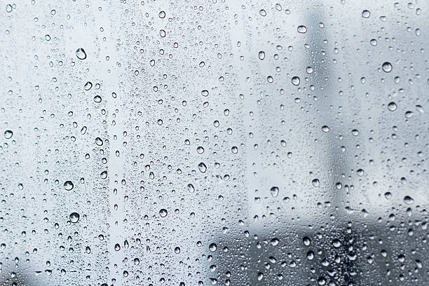 istock water droplet on mirror glass background. 543688914