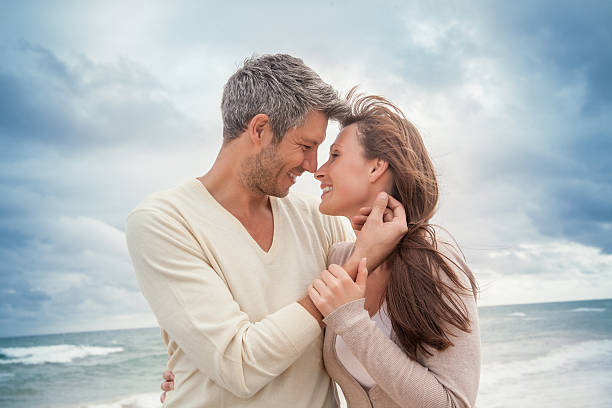 lovers on the beach stock photo