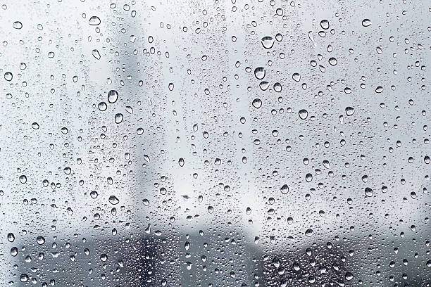 istock water droplet on mirror glass background. 543689284