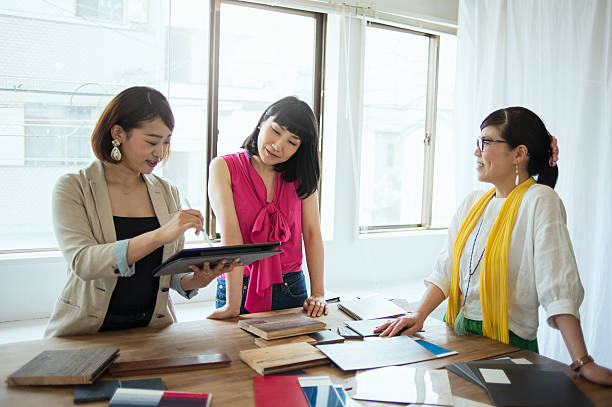 istock Team of interior designers discussing in the studio 543689870