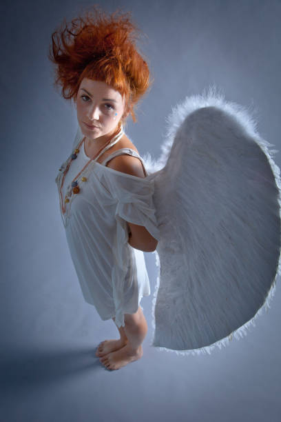 istock Red haired angel girl 543689946