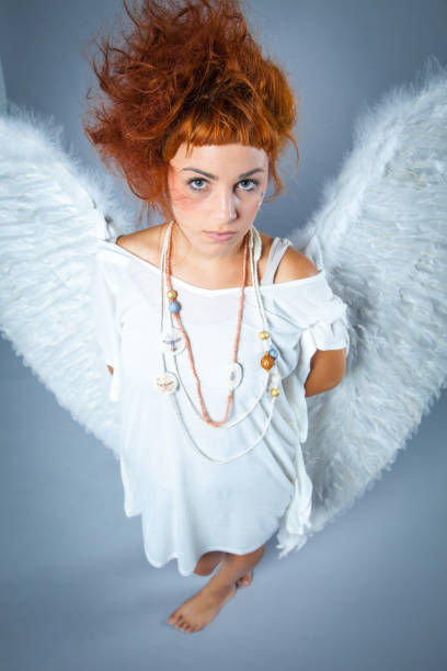istock Red haired angel girl 543689990