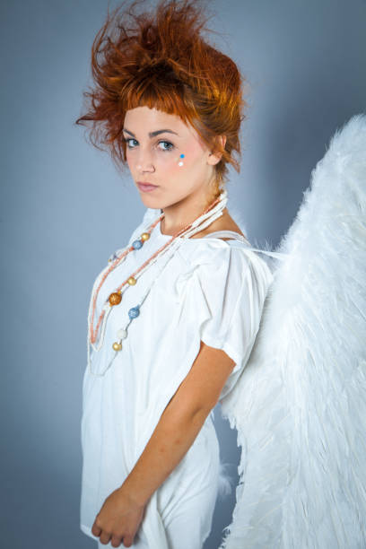 istock Red haired angel girl 543690040