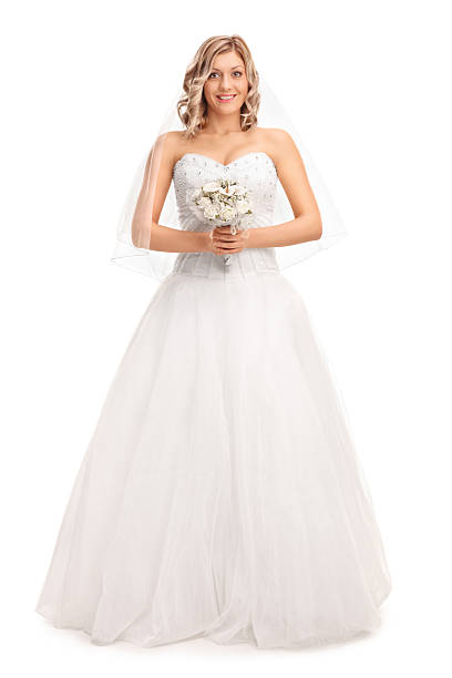 istock Blond bride holding a wedding flower 543690838