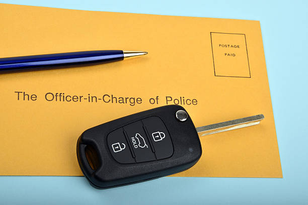 istock car key and police envelope 543691182