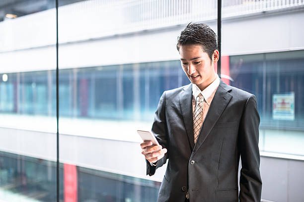 istock businessman standing in the office corridor 543692220