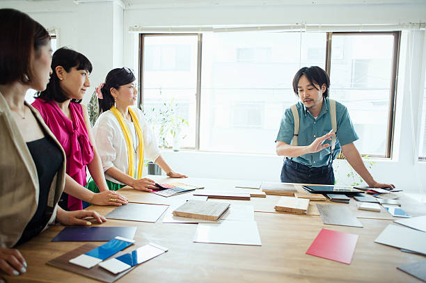 istock Team of interior designers discussing in the studio 543692678