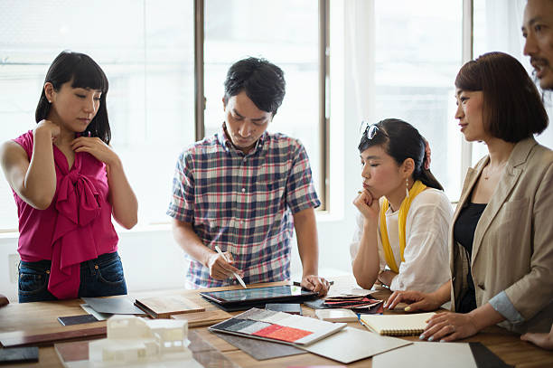 istock Team of interior designers discussing in the studio 543694152