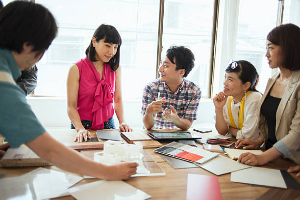 istock Team of interior designers discussing in the studio 543694542