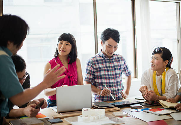 istock Team of interior designers discussing in the studio 543695334