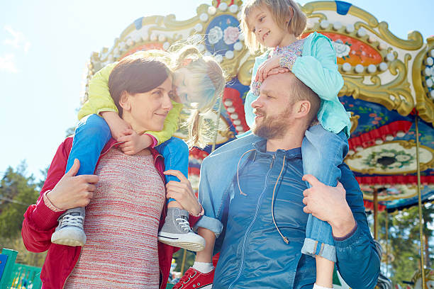 istock Family in amusement park 543696136