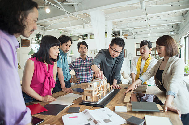 Team of interior designers discussing in the studio