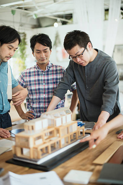 istock Team of interior designers discussing in the studio 543696318