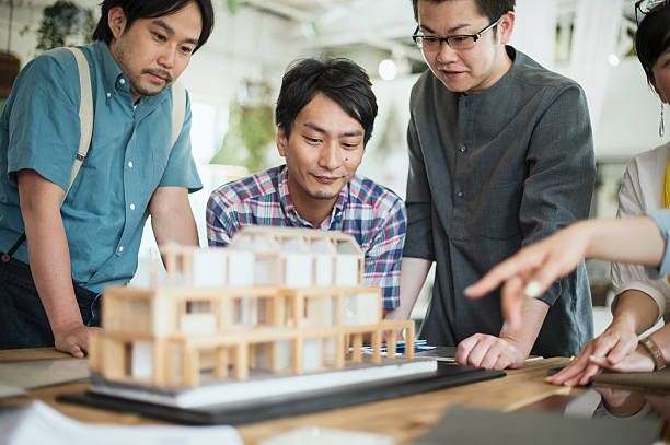 istock Team of interior designers discussing in the studio 543696356