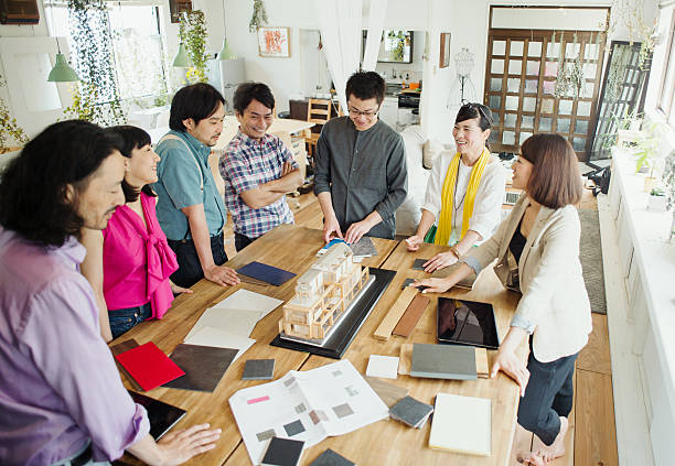 istock Team of interior designers discussing in the studio 543696504