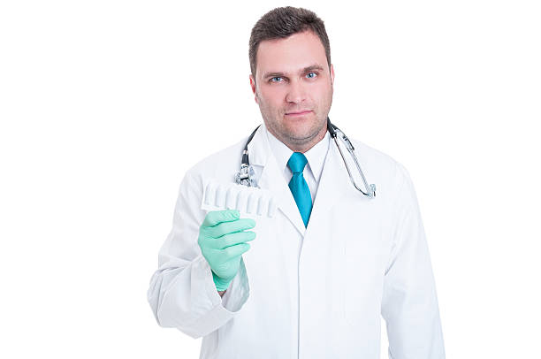 istock Male medic feeling uncomfortable about suppositories blister 543696586