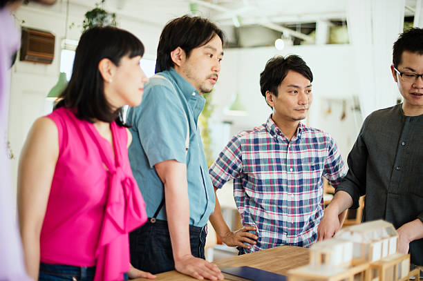 istock Team of interior designers discussing in the studio 543696642