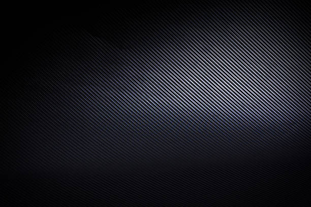 istock Dark and black carbon fiber background texture 543699158