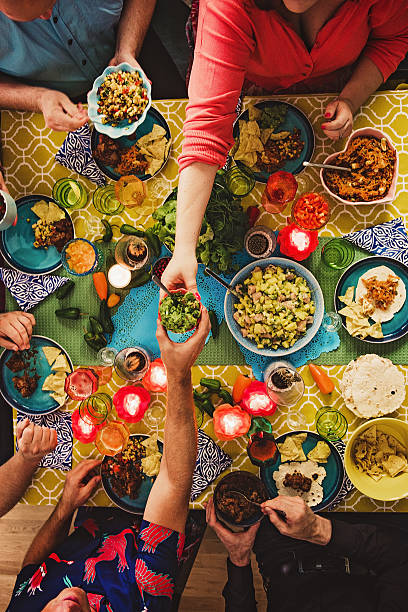 Friends having a Mexican tex mex dinner Friends having a Mexican tex mex dinner  mexican food stock pictures, royalty-free photos & images