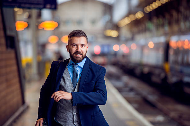 Hipster businessman at the staition running, catching the train Hipster businessman at the staition running to catch the train running to catch the train stock pictures, royalty-free photos & images