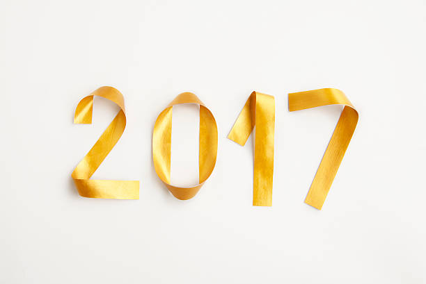 istock New year 2017 card with golden numbers on white surface 543806260
