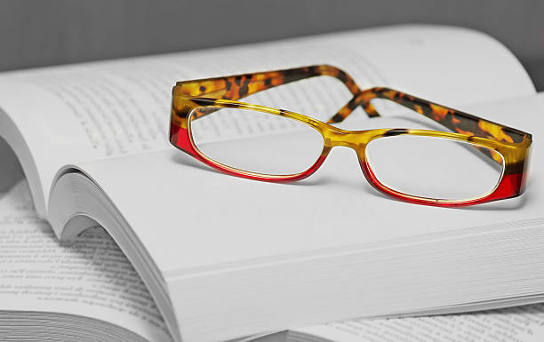 istock eyglasses on a pile of books 543808500