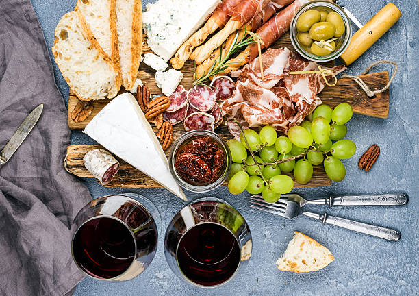 istock Cheese and meat appetizer selection. Prosciutto di Parma, salami, bread 543808678