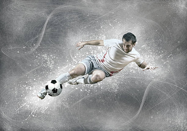 istock Football player with ball in action under sky with clouds 543809768